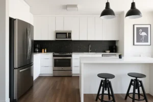 Renovated modern kitchen showcasing custom carpentry, fresh interior painting, and professional home maintenance work completed by experienced handyman services.